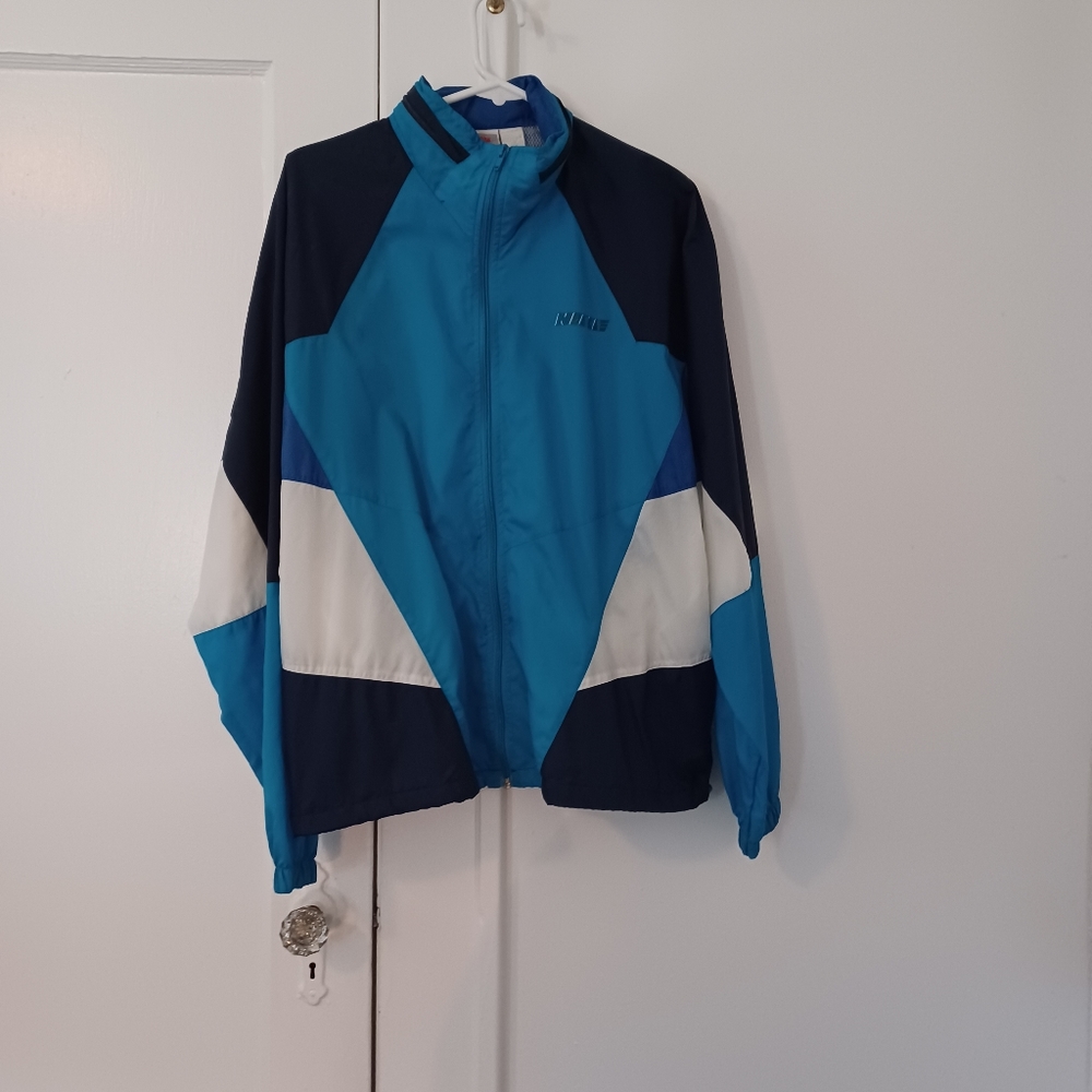 NIKE 1980s blue & white zip up nylon windbreaker with zip pocket…